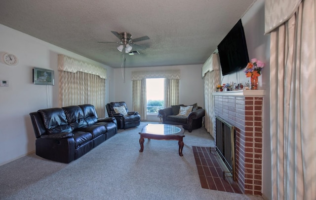living area featuring a textured ceiling, a brick fireplace, carpet flooring, and a ceiling fan