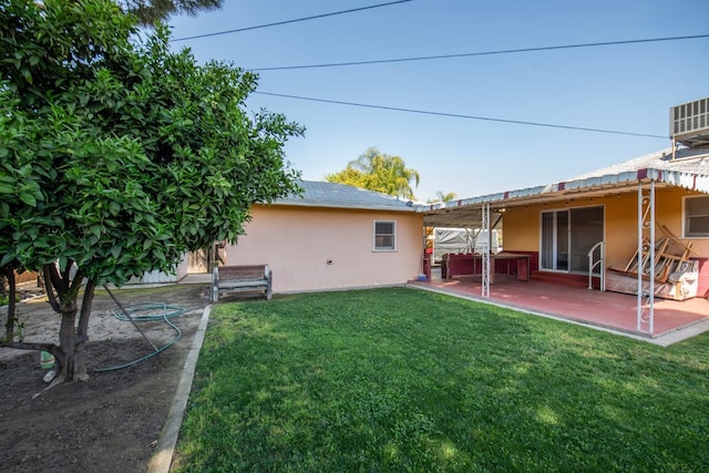 view of yard featuring central AC, a patio, and a jacuzzi