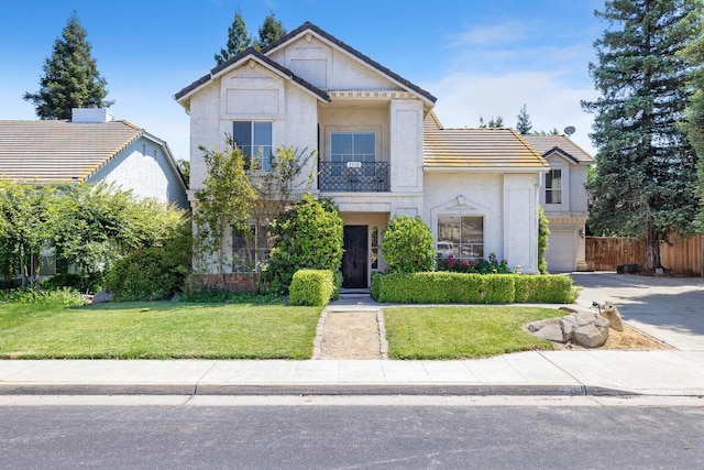 1110 Minarets Ave, Clovis, CA 93611 - view of front of property with stucco siding, concrete driveway, a tile roof, and a garage