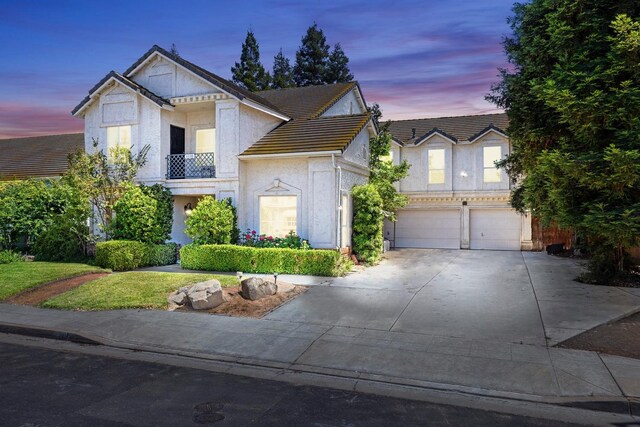 1110 Minarets Ave, Clovis, CA 93611 - view of front of property with concrete driveway, stucco siding, a garage, and a tile roof