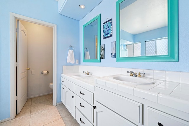1110 Minarets Ave, Clovis, CA 93611 - full bath featuring double vanity, toilet, and tile patterned floors