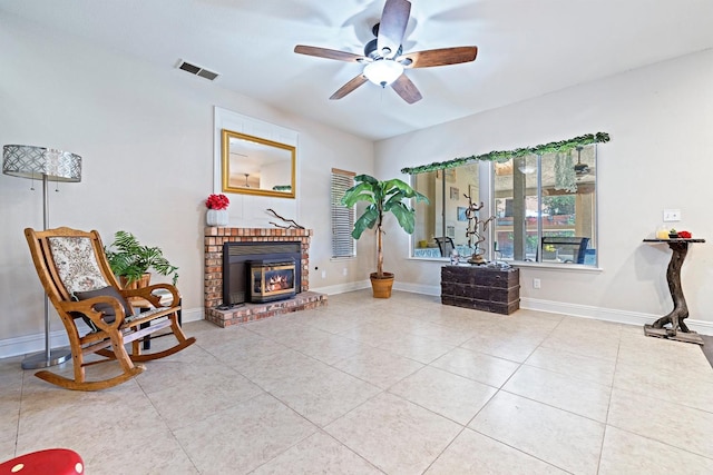 1110 Minarets Ave, Clovis, CA 93611 - living area featuring ceiling fan, tile patterned flooring, a brick fireplace, and baseboards