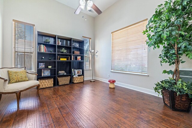 1110 Minarets Ave, Clovis, CA 93611 - sitting room featuring ceiling fan, wood finished floors, baseboards, and a towering ceiling
