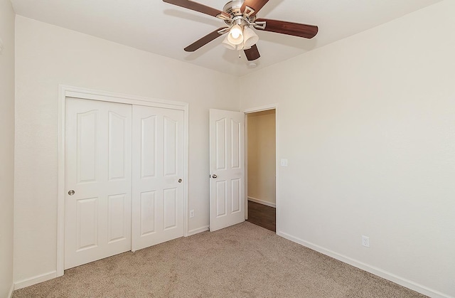 7448 E Ramona Way, Fresno, CA 93737 - unfurnished bedroom with light carpet, baseboards, a closet, and ceiling fan