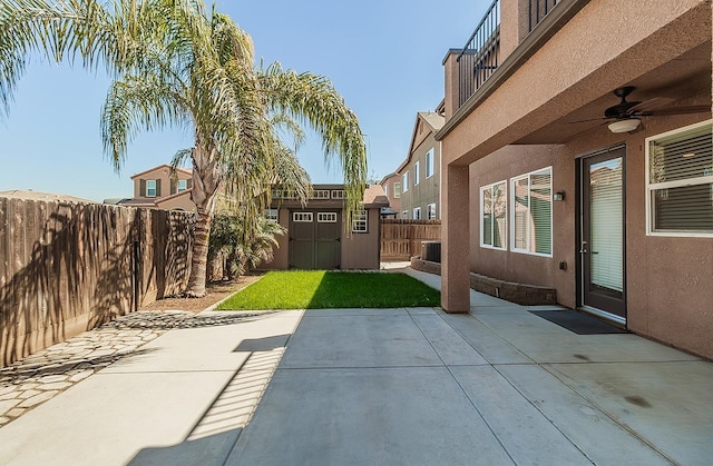7448 E Ramona Way, Fresno, CA 93737 - view of patio / terrace with a shed, a ceiling fan, an outdoor structure, a fenced backyard, and central AC unit