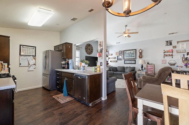 kitchen with dark brown cabinetry, light countertops, a ceiling fan, dark wood finished floors, and appliances with stainless steel finishes