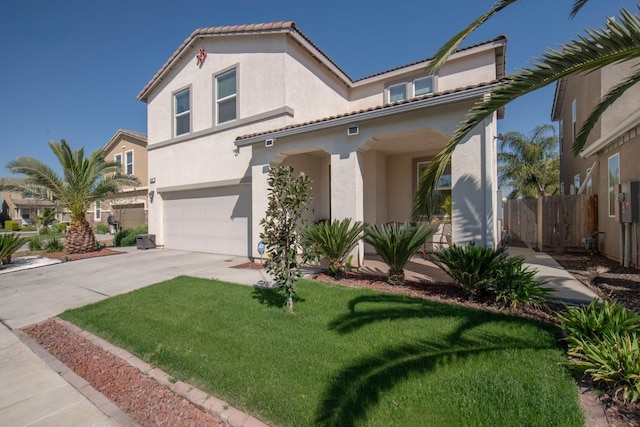 4865 E Alexander Ave, Fresno, CA 93725 - mediterranean / spanish home with stucco siding, an attached garage, driveway, and a tile roof