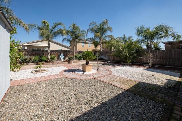 4865 E Alexander Ave, Fresno, CA 93725 - fenced backyard with a patio