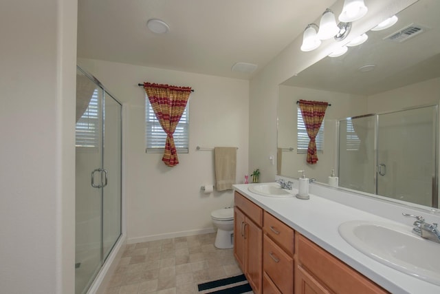 4865 E Alexander Ave, Fresno, CA 93725 - bathroom featuring plenty of natural light, double vanity, and a shower stall