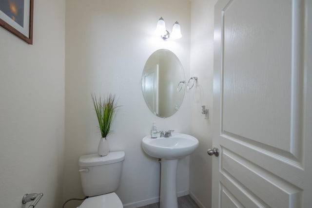 4865 E Alexander Ave, Fresno, CA 93725 - half bathroom featuring toilet and a sink