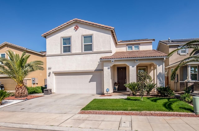4865 E Alexander Ave, Fresno, CA 93725 - mediterranean / spanish house with a tiled roof, a garage, stucco siding, and concrete driveway