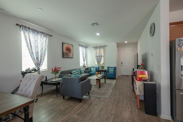 4865 E Alexander Ave, Fresno, CA 93725 - living room featuring wood finished floors and recessed lighting