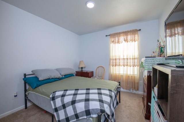 4865 E Alexander Ave, Fresno, CA 93725 - bedroom featuring light colored carpet and baseboards