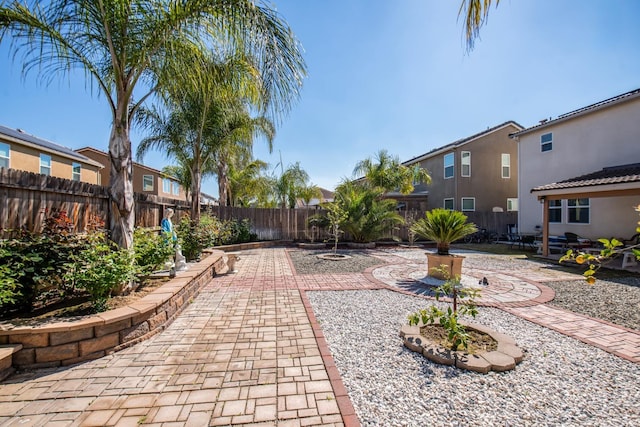 4865 E Alexander Ave, Fresno, CA 93725 - fenced backyard featuring a patio area