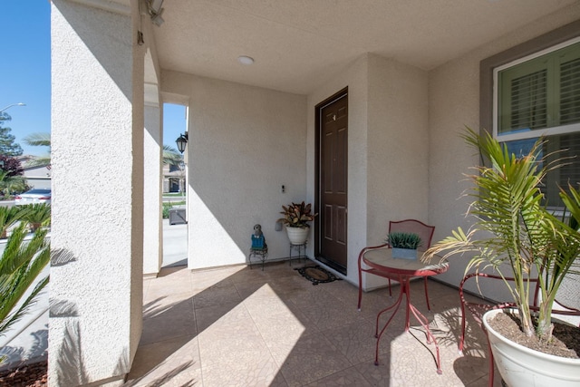 4865 E Alexander Ave, Fresno, CA 93725 - entrance to property featuring stucco siding and a patio