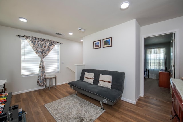 4865 E Alexander Ave, Fresno, CA 93725 - sitting room featuring wood finished floors, recessed lighting, and an upstairs landing