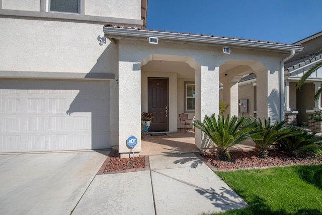 4865 E Alexander Ave, Fresno, CA 93725 - view of exterior entry featuring stucco siding and driveway