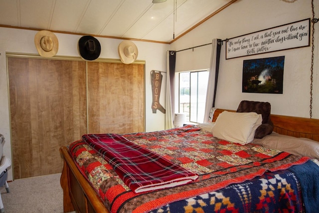 carpeted bedroom featuring vaulted ceiling