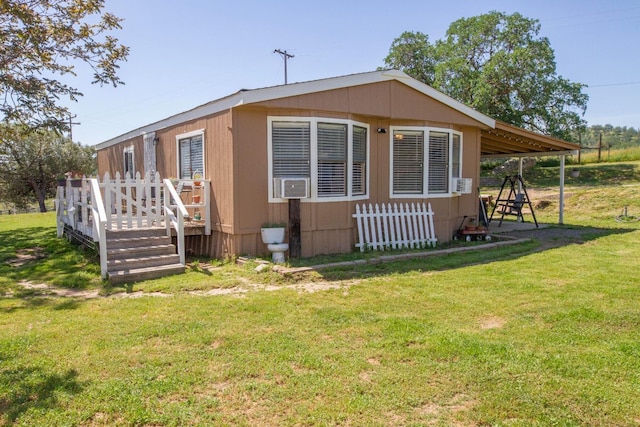 view of property exterior with a yard and a wooden deck