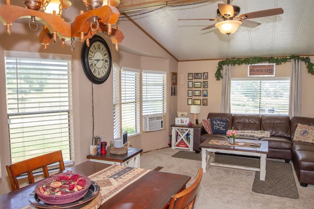living room with plenty of natural light, carpet, vaulted ceiling, and a ceiling fan