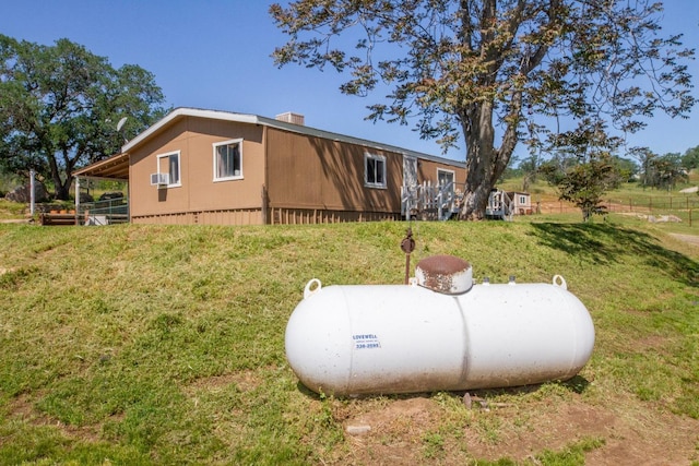view of property exterior with a yard and cooling unit