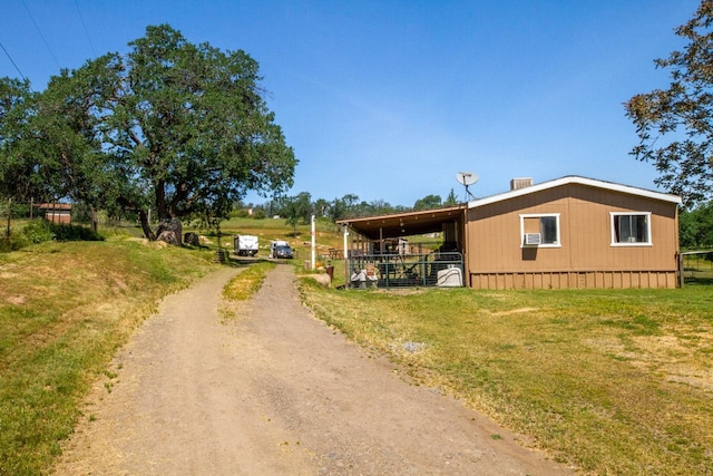 view of front of house featuring a carport and driveway