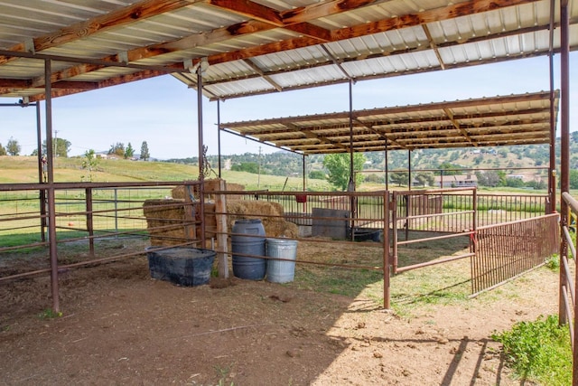 view of stable featuring a rural view