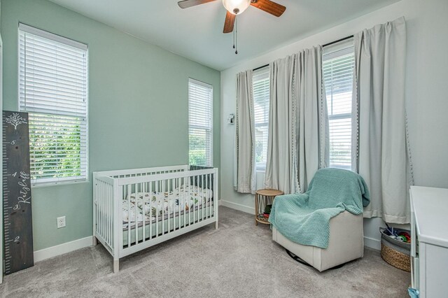 408 Grant Ave W, Madera, CA 93636 - bedroom featuring carpet floors, a nursery area, and baseboards
