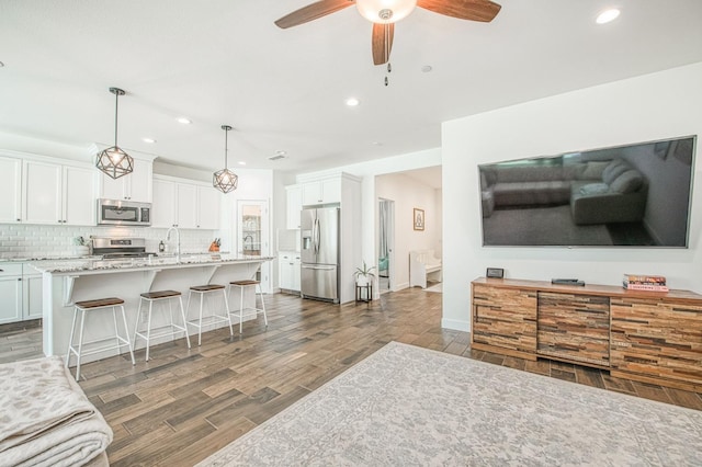 408 Grant Ave W, Madera, CA 93636 - living area featuring recessed lighting, a ceiling fan, and dark wood finished floors