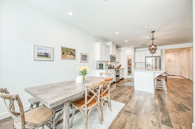 408 Grant Ave W, Madera, CA 93636 - dining area with recessed lighting, light wood-style flooring, and baseboards