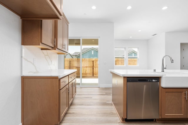 276 Huckleberry Ln S, Madera, CA 93636 - kitchen with a sink, light countertops, light wood-style flooring, and dishwasher
