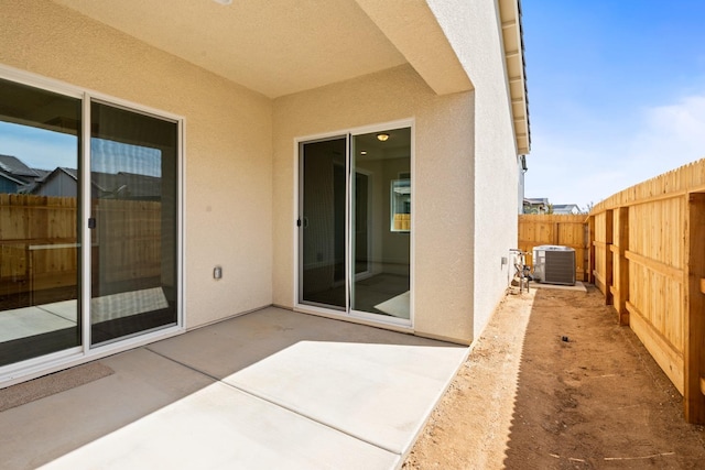 276 Huckleberry Ln S, Madera, CA 93636 - view of patio featuring a fenced backyard and central air condition unit