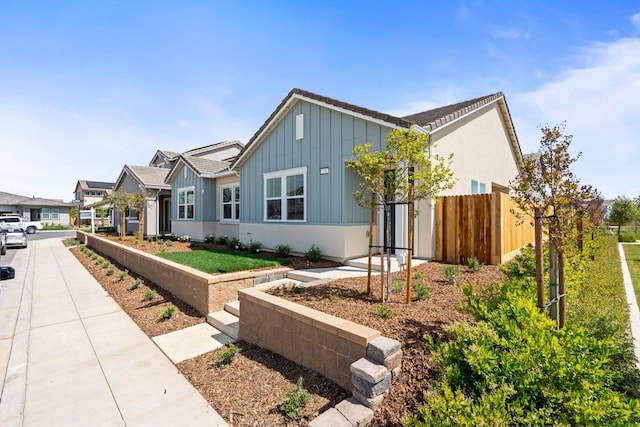 276 Huckleberry Ln S, Madera, CA 93636 - view of front of property featuring board and batten siding and fence