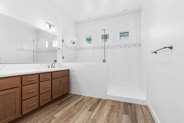 276 Huckleberry Ln S, Madera, CA 93636 - full bathroom with a sink, double vanity, a walk in shower, and wood finished floors