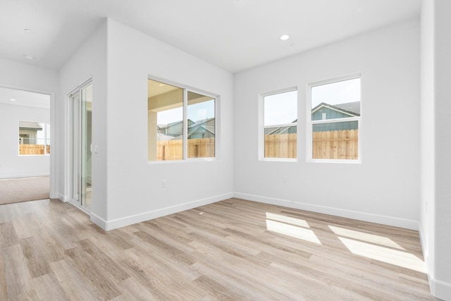 276 Huckleberry Ln S, Madera, CA 93636 - empty room featuring baseboards, plenty of natural light, and light wood-type flooring