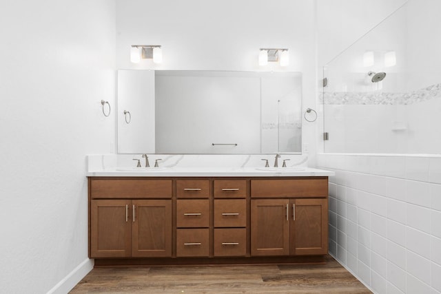 276 Huckleberry Ln S, Madera, CA 93636 - full bathroom with a sink, a tile shower, double vanity, and wood finished floors