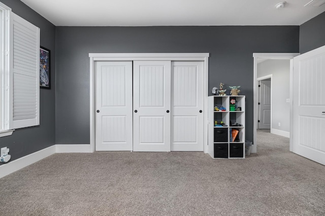 3887 N Condor Ct, Sanger, CA 93657 - carpeted bedroom with a closet and baseboards