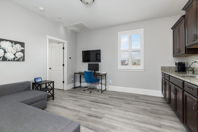 3887 N Condor Ct, Sanger, CA 93657 - living room with light wood-style flooring and an office area