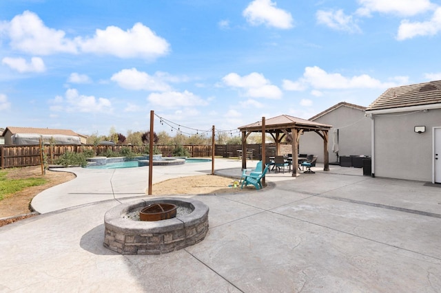 3887 N Condor Ct, Sanger, CA 93657 - fenced backyard with an outdoor fire pit, a gazebo, a patio area, and a pool with connected hot tub