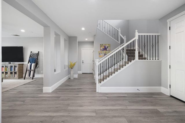 3887 N Condor Ct, Sanger, CA 93657 - foyer entrance with recessed lighting, wood finished floors, and stairs