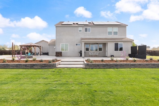 3887 N Condor Ct, Sanger, CA 93657 - back of property with a gazebo, a patio, solar panels, and stucco siding