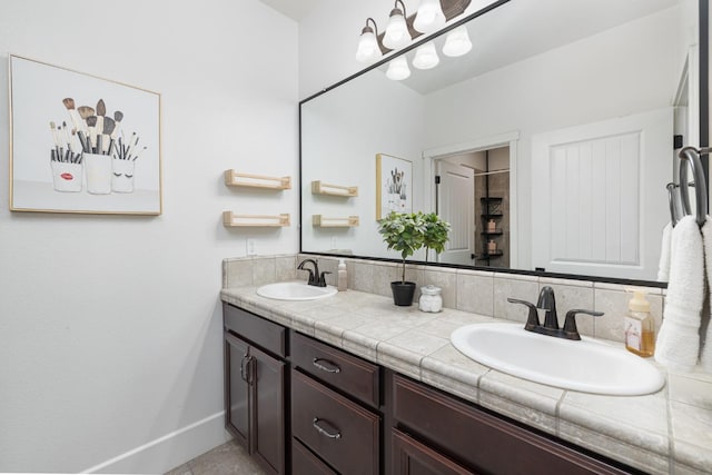 3887 N Condor Ct, Sanger, CA 93657 - full bath featuring double vanity and baseboards