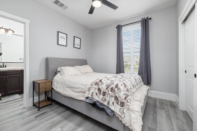 3887 N Condor Ct, Sanger, CA 93657 - bedroom with light wood finished floors, a closet, ensuite bathroom, and a ceiling fan