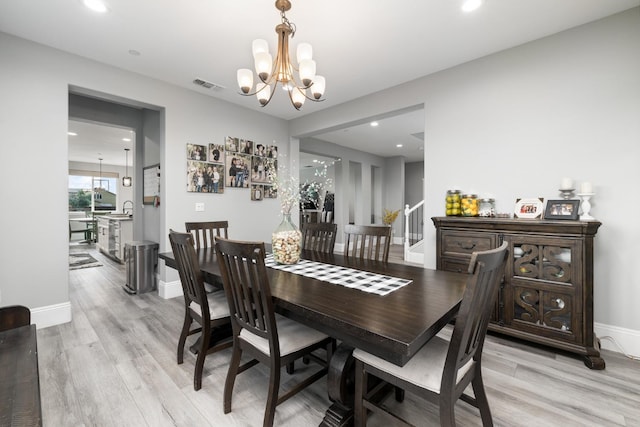 3887 N Condor Ct, Sanger, CA 93657 - dining room with a chandelier, light wood-style flooring, and recessed lighting