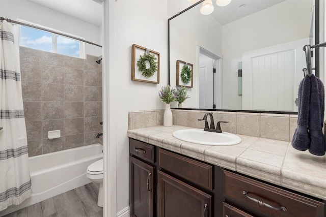 3887 N Condor Ct, Sanger, CA 93657 - full bathroom featuring vanity, shower / bath combination with curtain, and wood finished floors