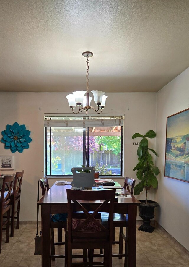 26174 Haley Way, Madera, CA 93638 - dining area featuring a notable chandelier and a textured ceiling