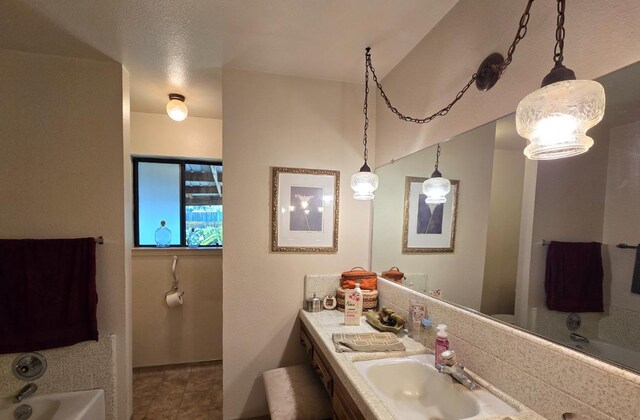 26174 Haley Way, Madera, CA 93638 - full bathroom featuring tile patterned flooring, a bath, and vanity