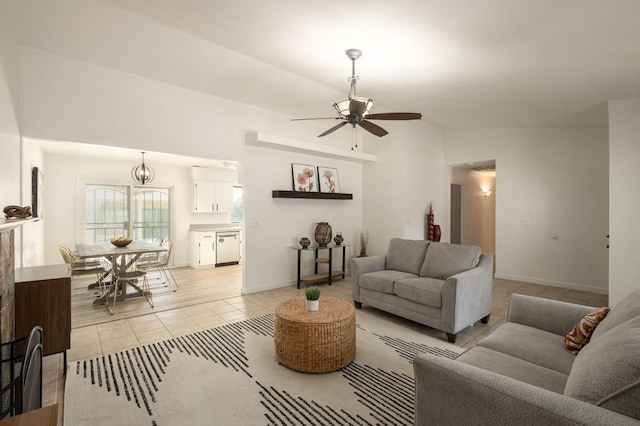 living room featuring light tile patterned flooring, baseboards, lofted ceiling, and ceiling fan