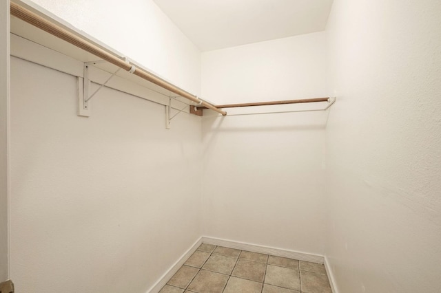 walk in closet featuring light tile patterned floors