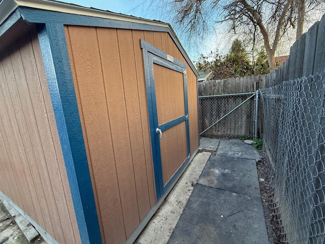 view of shed with fence